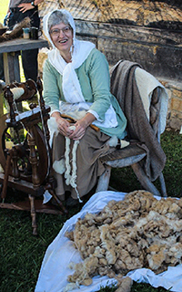 Re-enactor explains how flax is woven into cloth