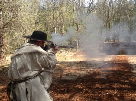 Black Powder Demonstration A reenactor fires a gun for a Black Powder Demonstration