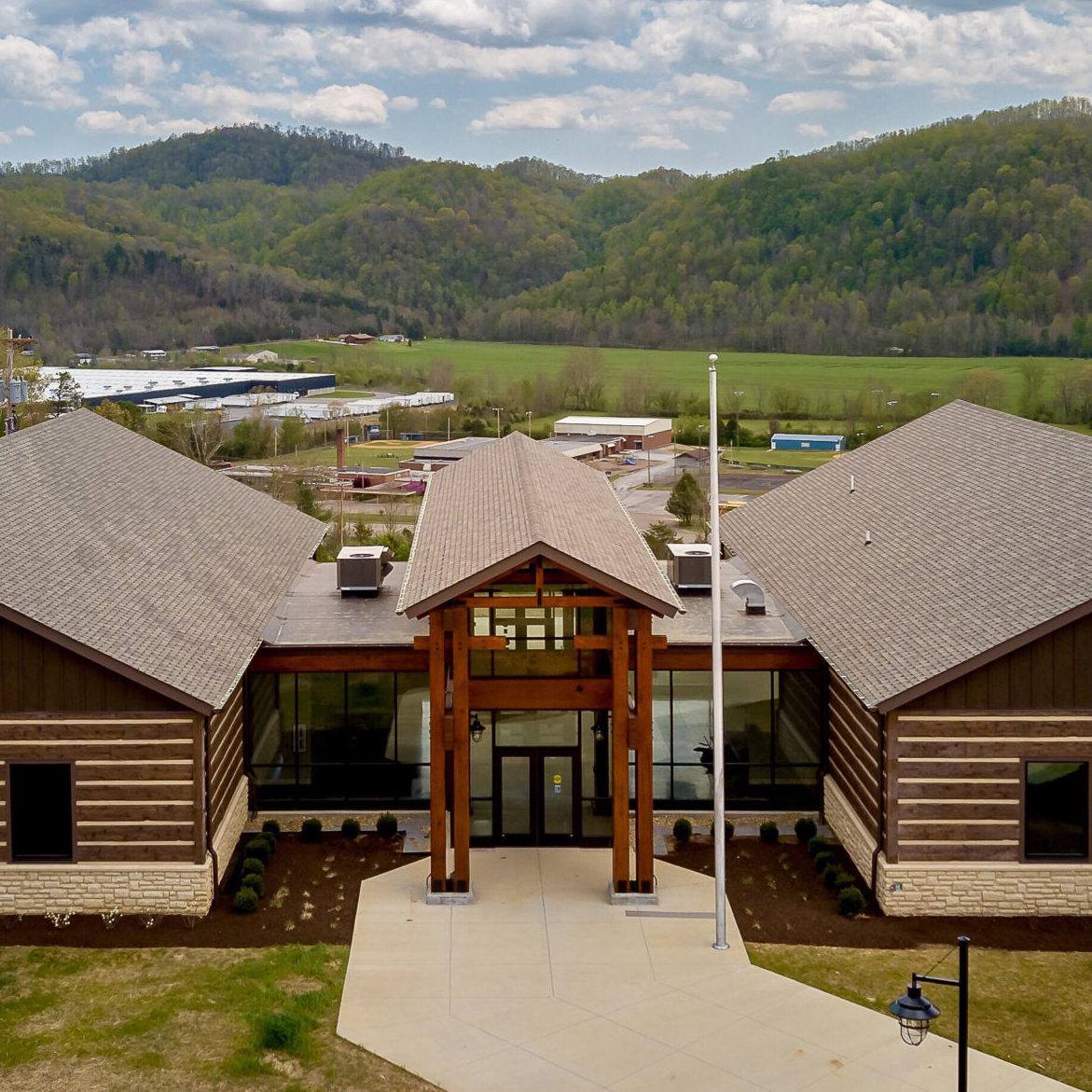 The Daniel Boone Wilderness Trail Interpretative Center with mountains in the background.