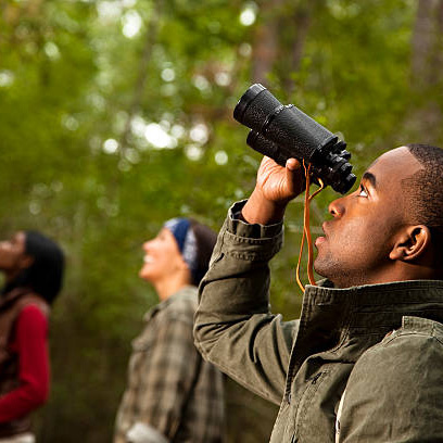 Group of friends camping and hiking using binoculars Bird Watcher Hike