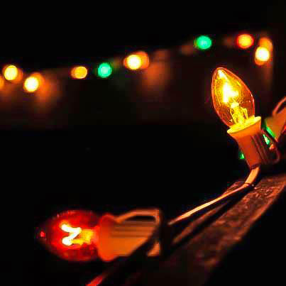 A closeup of lit Christmas bulbs