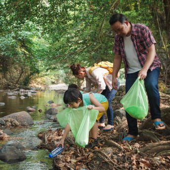 Collecting rubbish from the river Creek Cleanup