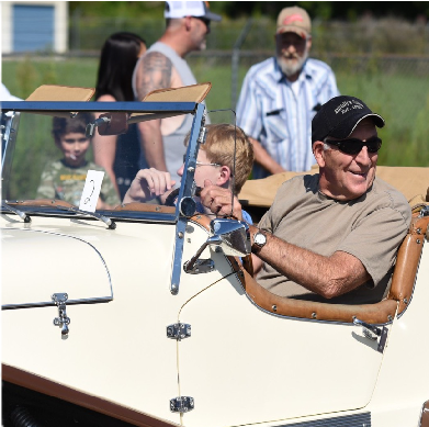 A man driving a vintage car at Duffield daze festival