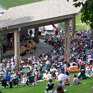 A crowd gathers around an amphitheater for Pickin' in the Park